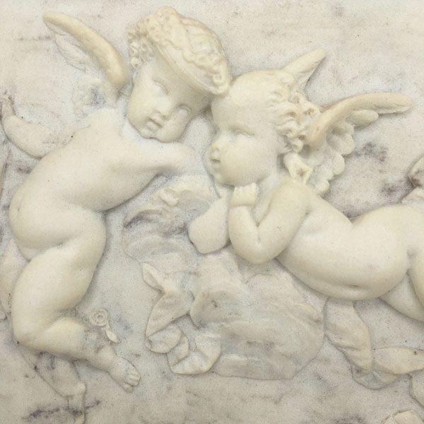 framed alabaster relief plaque with putti